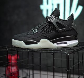 Side view of Jordan 4 Eminem Carhartt reps with chrome eyelets