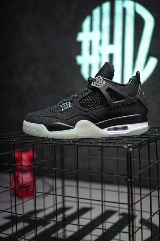 Side view of Jordan 4 Eminem Carhartt reps with chrome eyelets