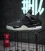 Side view of Jordan 4 Eminem Carhartt reps with chrome eyelets