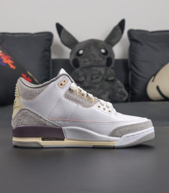 Side view of A Ma Maniere Jordan 3 reps in grey suede and aged midsole