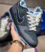 Blue Lobster Dunk Reps handheld side view showing dark navy suede upper