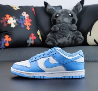 Single shoe side view of UNC Dunk Low replica with clean white base