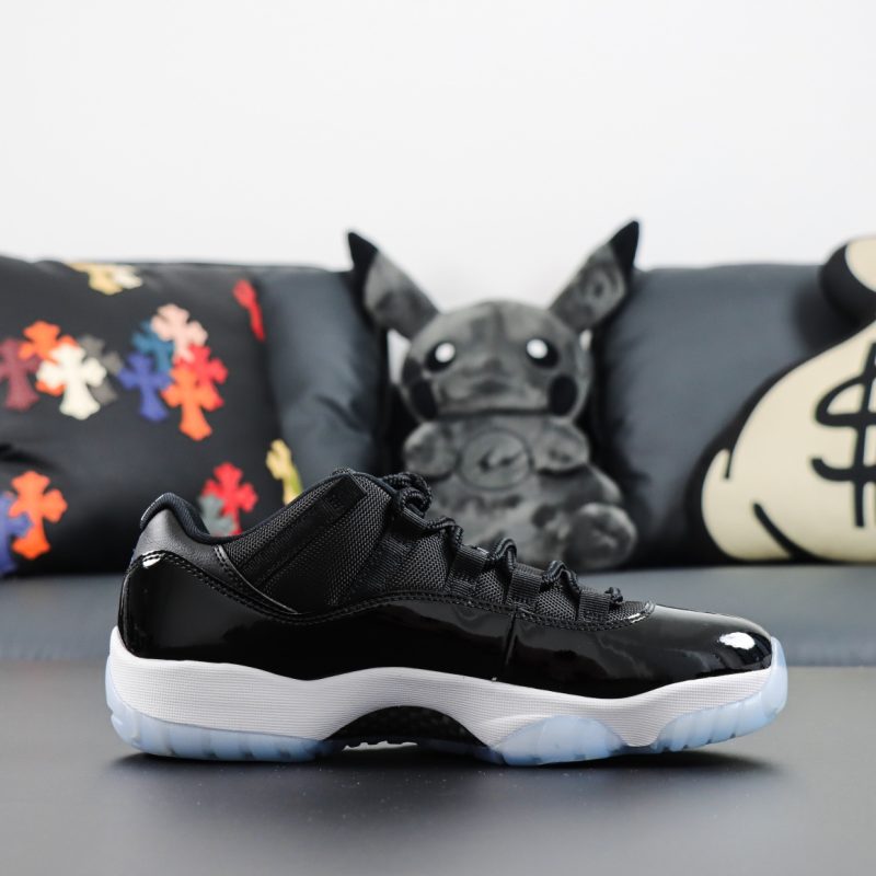 Side view of Jordan 11 Space Jam reps low with mesh and icy sole