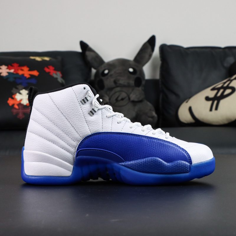 Inner side of Jordan 12 Blueberry reps showing tumbled leather and stitched trim