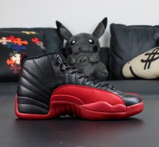 Inner view of Jordan 12 Flu Game 2025 reps with Varsity Red overlay