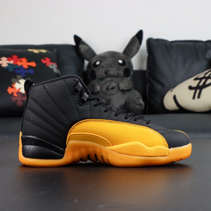 Inner side of Jordan 12 University Gold reps with leather texture and gold accent