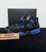 Jordan 4 Blue Thunder Reps with box displayed on table