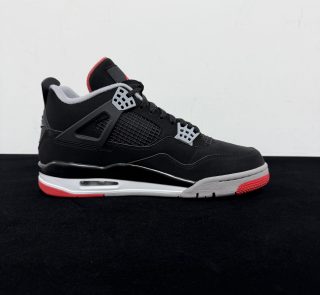 Medial side view of Jordan 4 Bred Reps with mesh panels