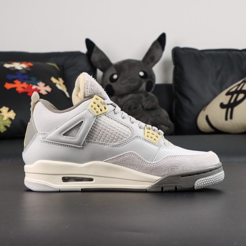 Inner side of Jordan 4 Craft Photon Dust reps with mesh and suede construction