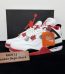 Jordan 4 Fire Red Reps with box displayed on table
