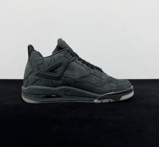 Inside view of Jordan 4 KAWS Black Reps with embossed hand graphics