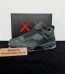 Jordan 4 KAWS Black Reps with box displayed on table