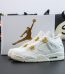 Jordan 4 Metallic Gold reps with shoebox and gold accent details