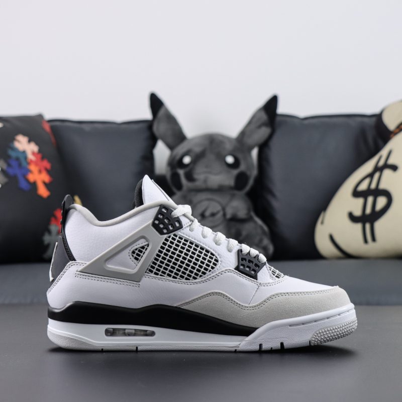 Side view of Jordan 4 Military Black reps showing black eyelets and grey mudguard