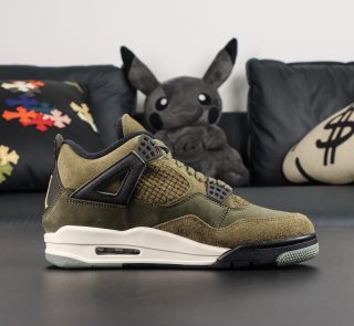 Inner side of Jordan 4 Olive reps with suede and mesh panels