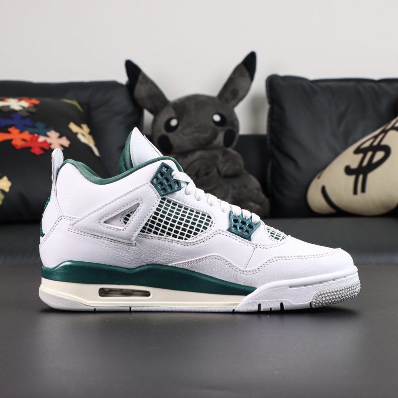 Inner side of Jordan 4 Oxidized Green reps showing mesh panels and green accents