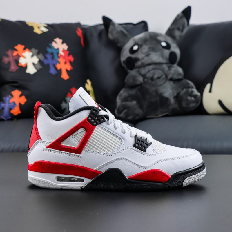 Side view of Jordan 4 Red Cement replica sneaker with white leather upper