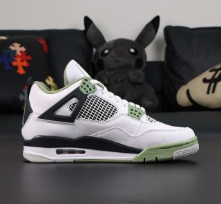 Inner side of Jordan 4 Seafoam Oil Green reps with mesh panels and olive green accent