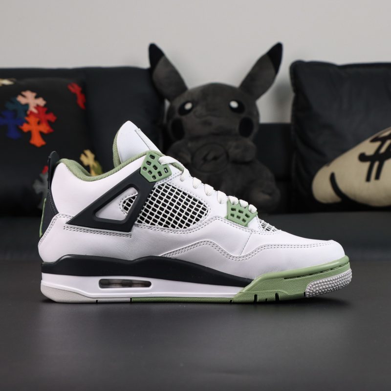 Inner side of Jordan 4 Seafoam Oil Green reps with mesh panels and olive green accent