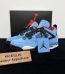 Jordan 4 Travis Scott Reps with box displayed on table