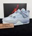 Jordan 4 UNC PE Reps with box displayed on table