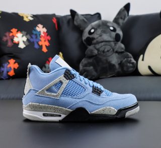 Side view of Jordan 4 University Blue reps showing UNC blue suede and grey speckled wings