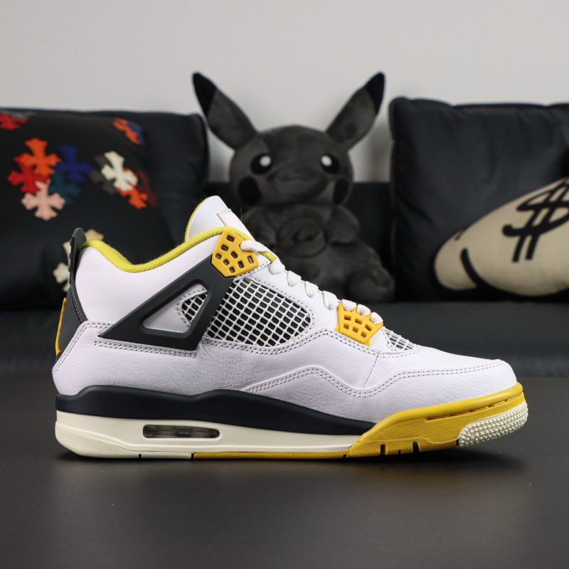 Inner view of Jordan 4 Vivid Sulfur reps with mesh panels and black midsole detailing