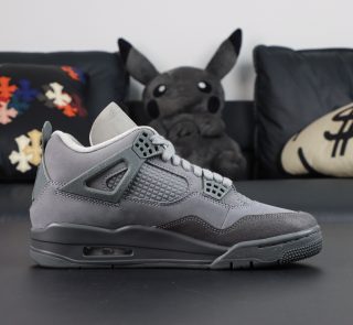 Inner side of Jordan 4 Wet Cement reps with mesh panels and grey leather construction