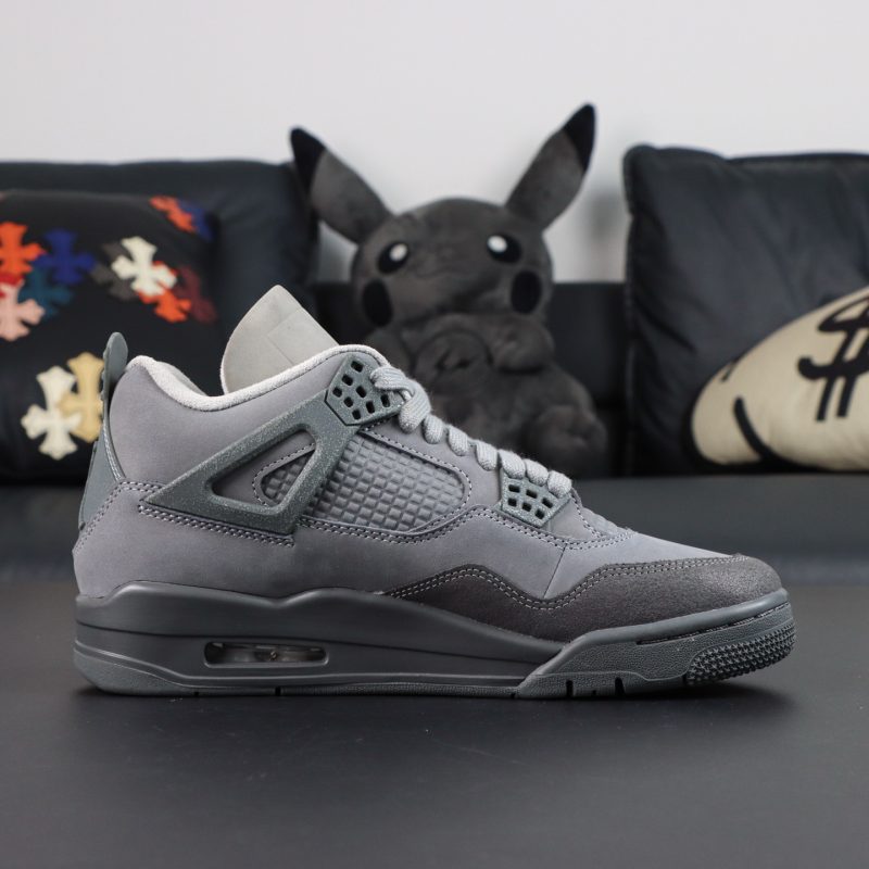 Inner side of Jordan 4 Wet Cement reps with mesh panels and grey leather construction