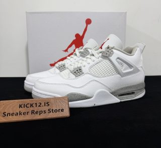 Jordan 4 White Oreo Reps with box displayed on table