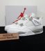 Jordan 4 White Oreo Reps with box displayed on table
