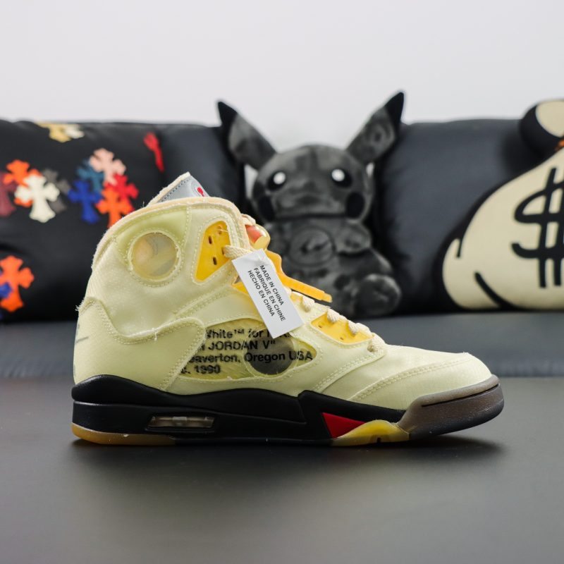 Inside view of Jordan 5 Off White Sail reps with aged cutout design