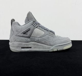 Medial side view of KAWS Jordan 4 Grey Reps with hand graphics