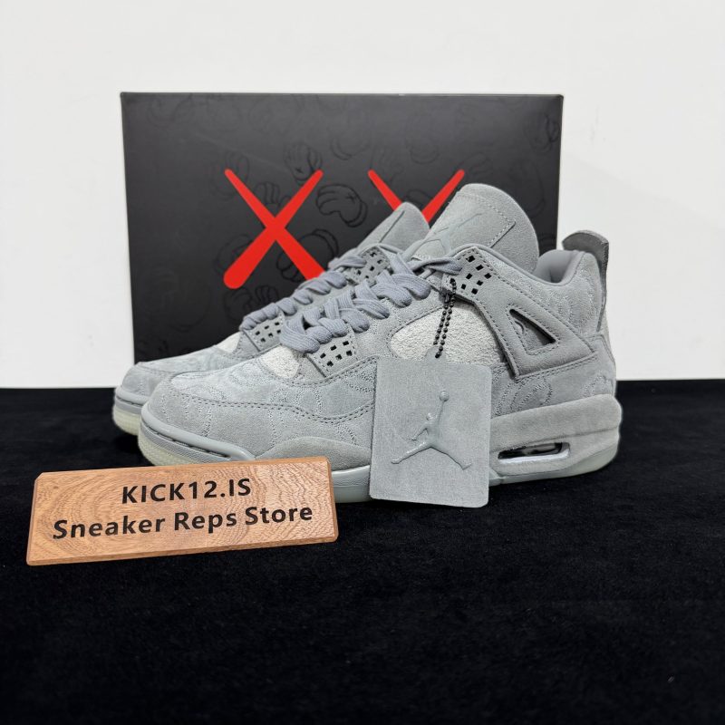 KAWS Jordan 4 Grey Reps with box displayed on table