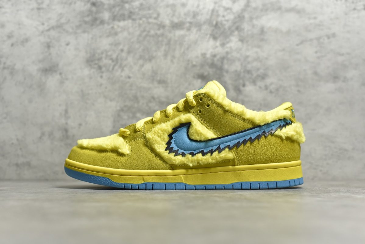Outside view of Yellow Bear Dunks reps with stash tongue