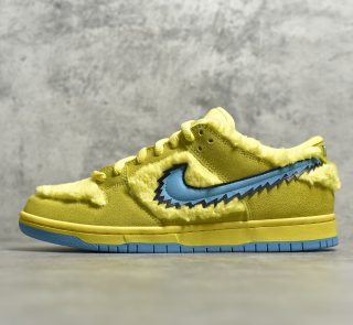 Outside view of Yellow Bear Dunks reps with stash tongue