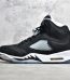 Black nubuck upper on Air Jordan 5 Oreo replica from side angle