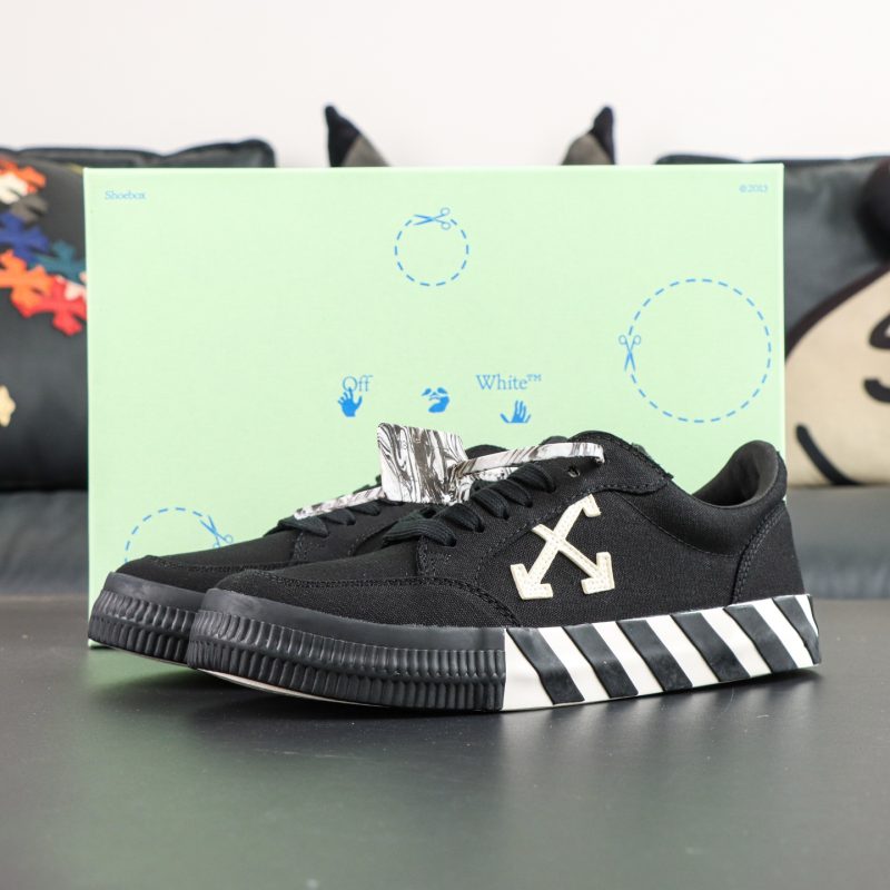 Side view of Off White Low Vulcanized Black White Reps