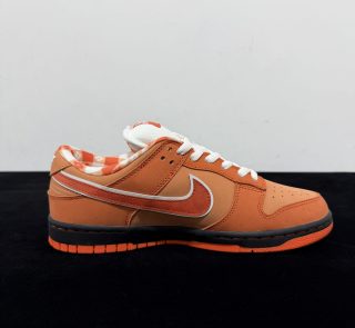 Inside view of Orange Lobster Dunks Reps with speckled orange panel details