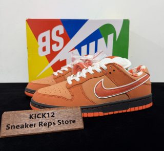 Orange Lobster Dunks Reps with box displayed on table