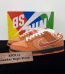 Orange Lobster Dunks Reps with box displayed on table