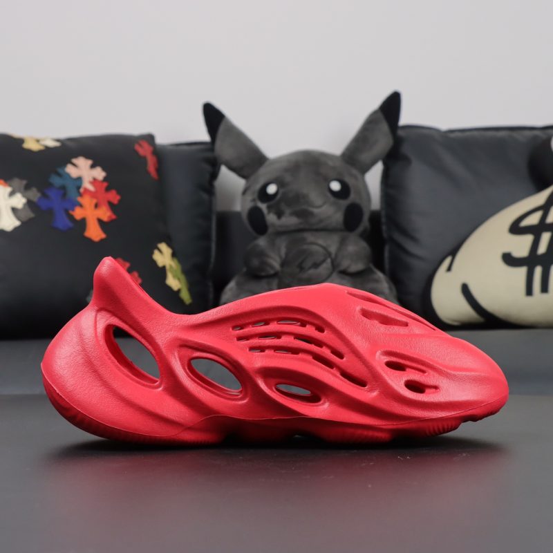 Single side view of Vermilion Yeezy Foam Runner in vivid red